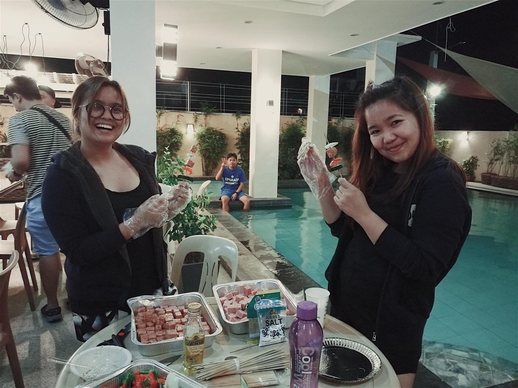 Tin and Jessa marinating wagyu cubes